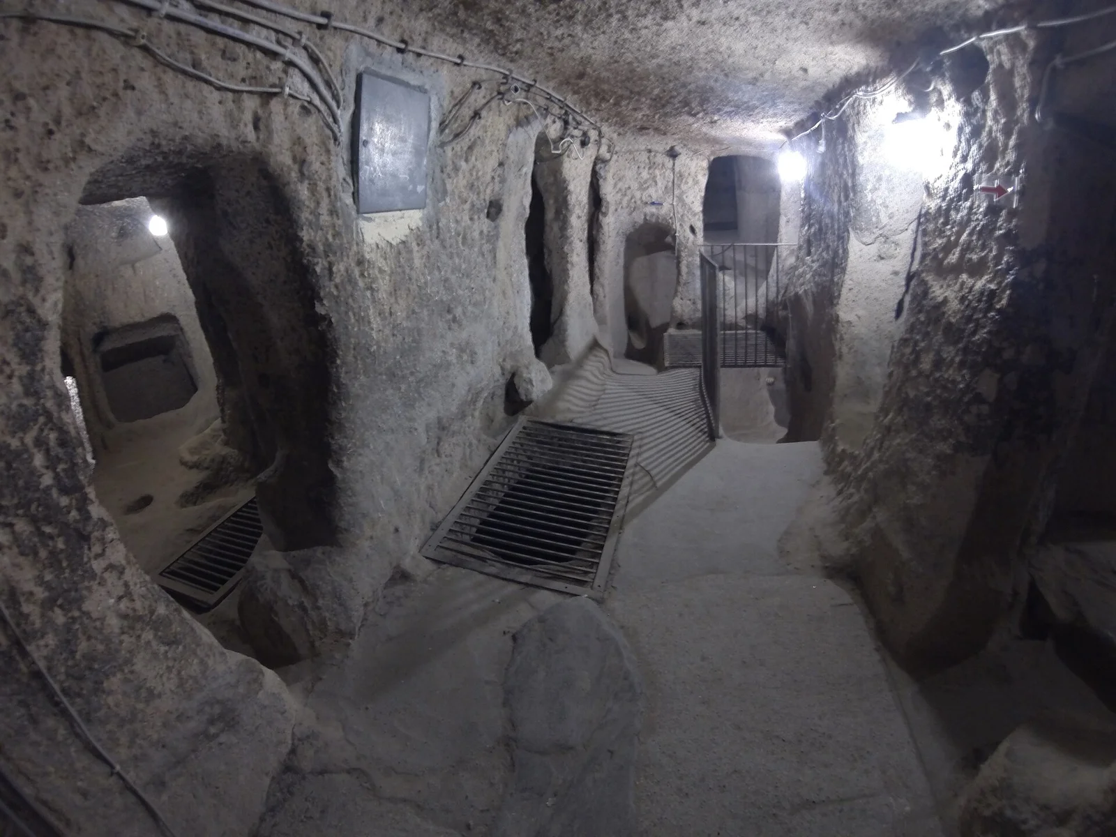 Carved openings and modern route fittings within Kaymakli Underground City