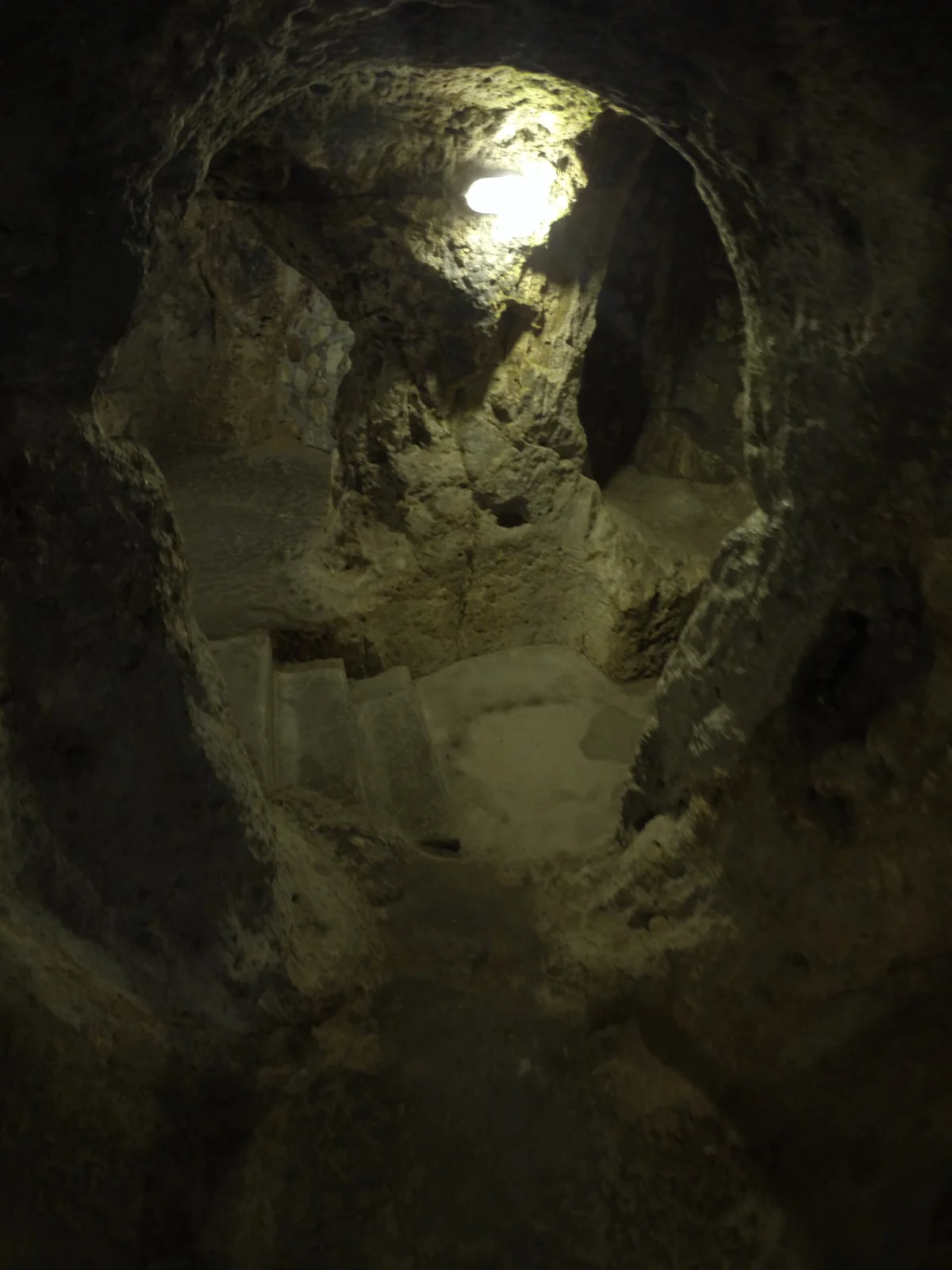 A small rock-cut opening and passage inside Derinkuyu