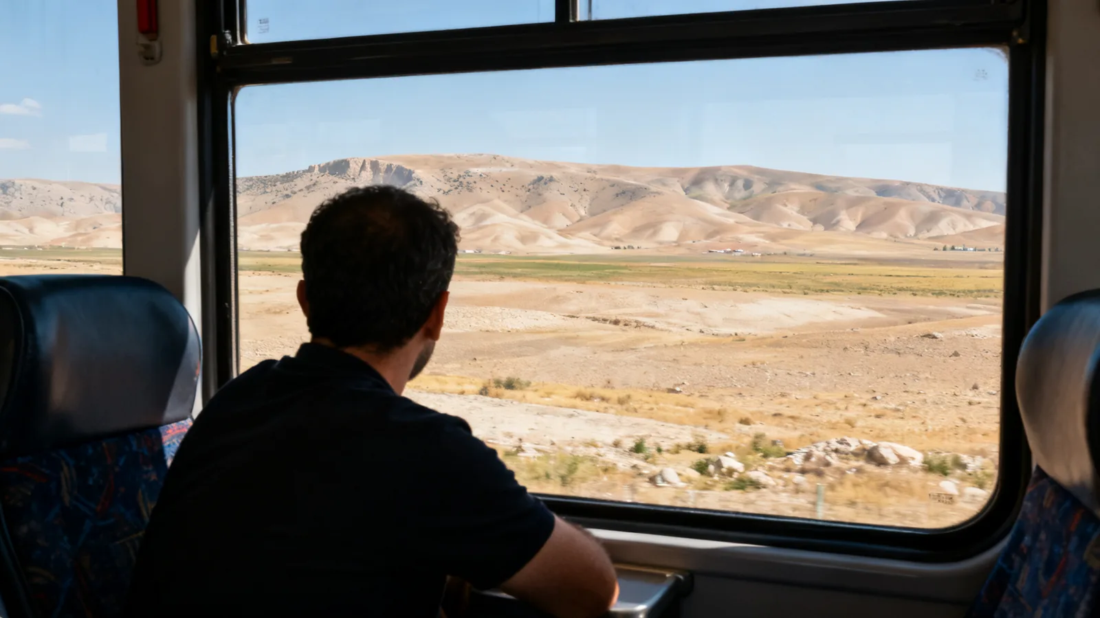 A passenger from behind looking across the Anatolian plateau from a coach